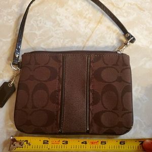 Dark brown Coach wristlet